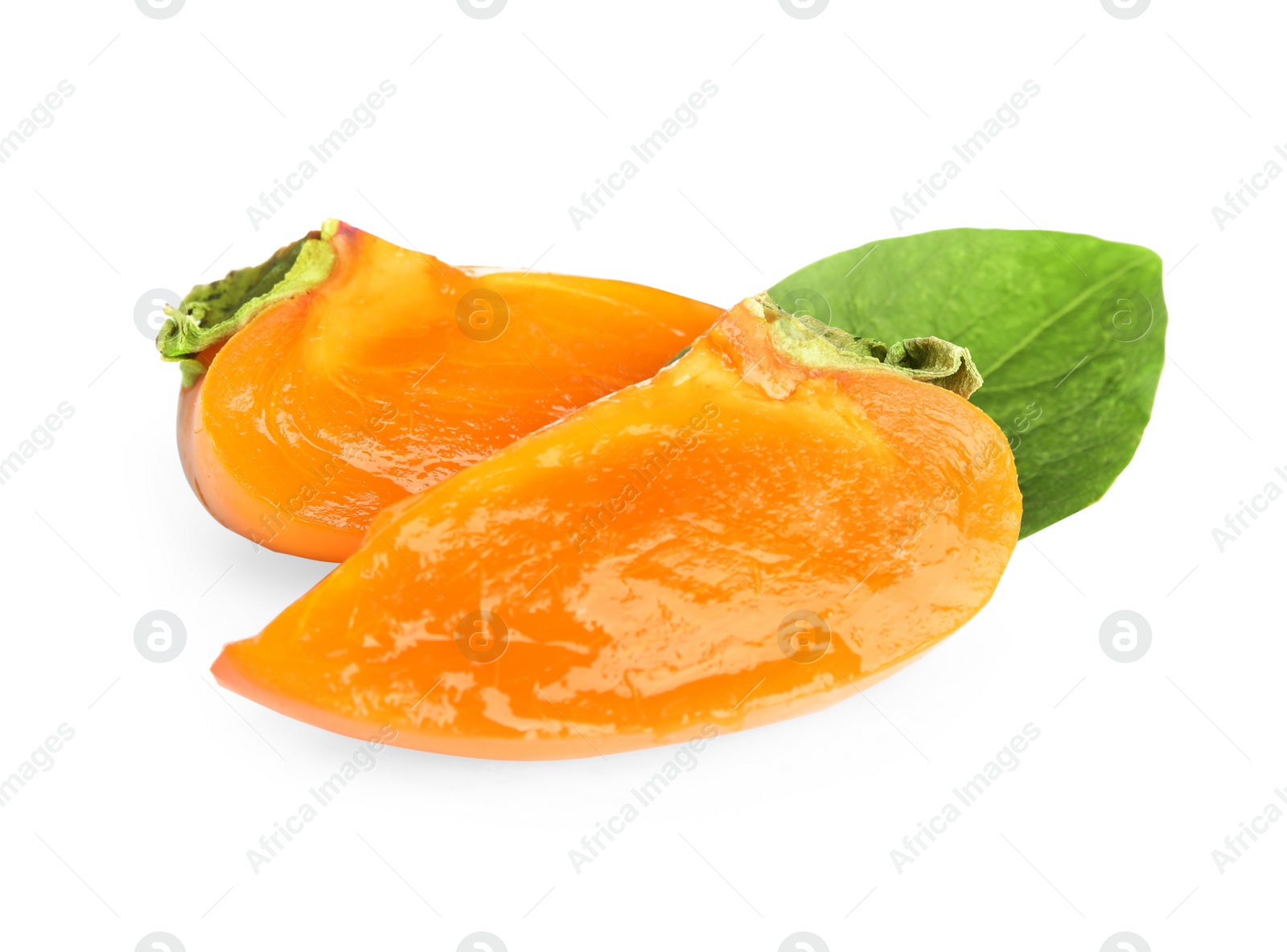 Slices of delicious persimmon and green leaf isolated on white Photo of Slices of delicious persimmon and green leaf isolated on white