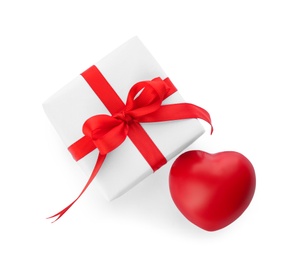 Beautiful gift box and red heart on white background, top view. Valentine's day celebration Photo of Beautiful gift box and red heart on white background, top view. Valentine's day celebration