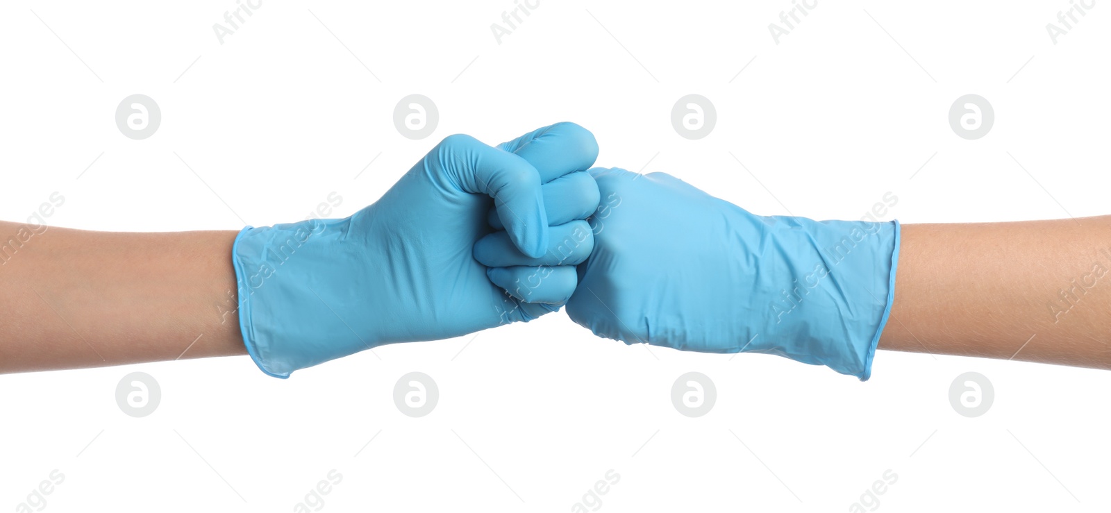 Doctors in medical gloves making fist bump on white background, closeup Photo of Doctors in medical gloves making fist bump on white background, closeup
