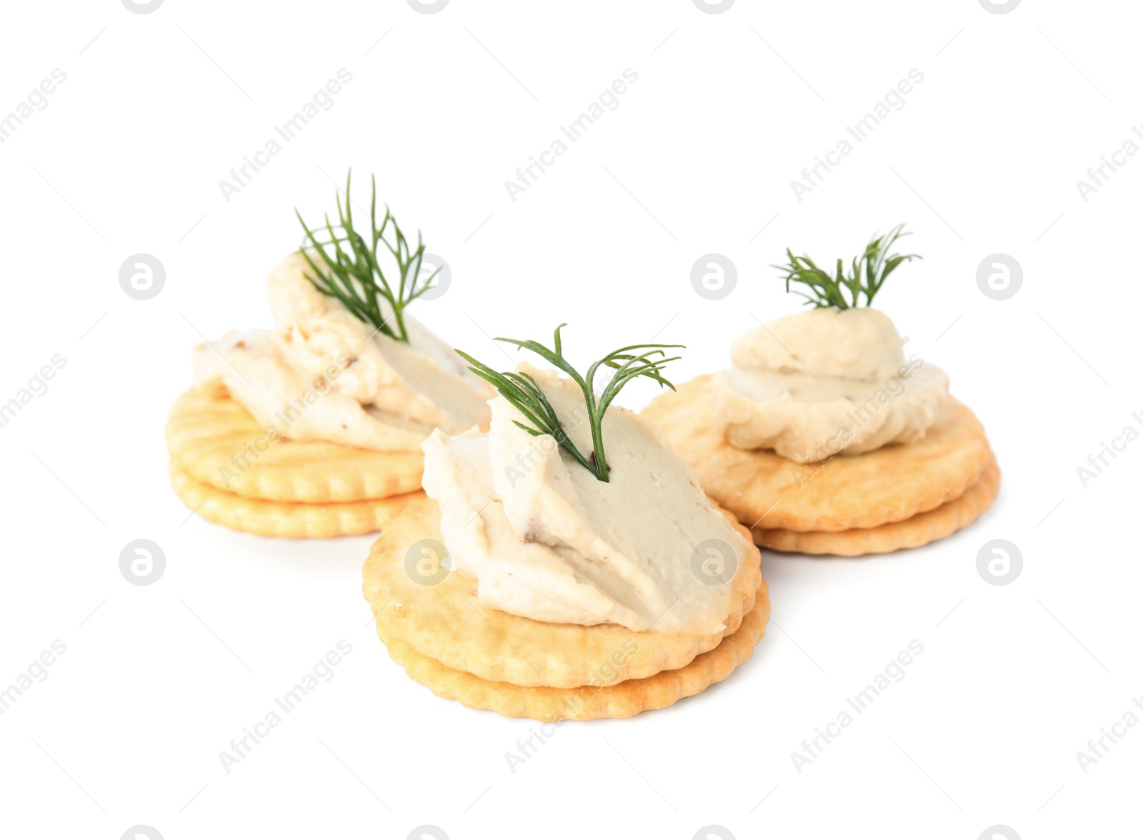 Delicious crackers with humus and dill on white background Photo of Delicious crackers with humus and dill on white background