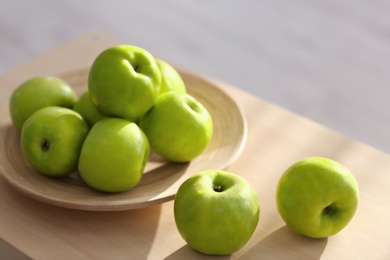 Ripe green apples on table Photo of Ripe green apples on table