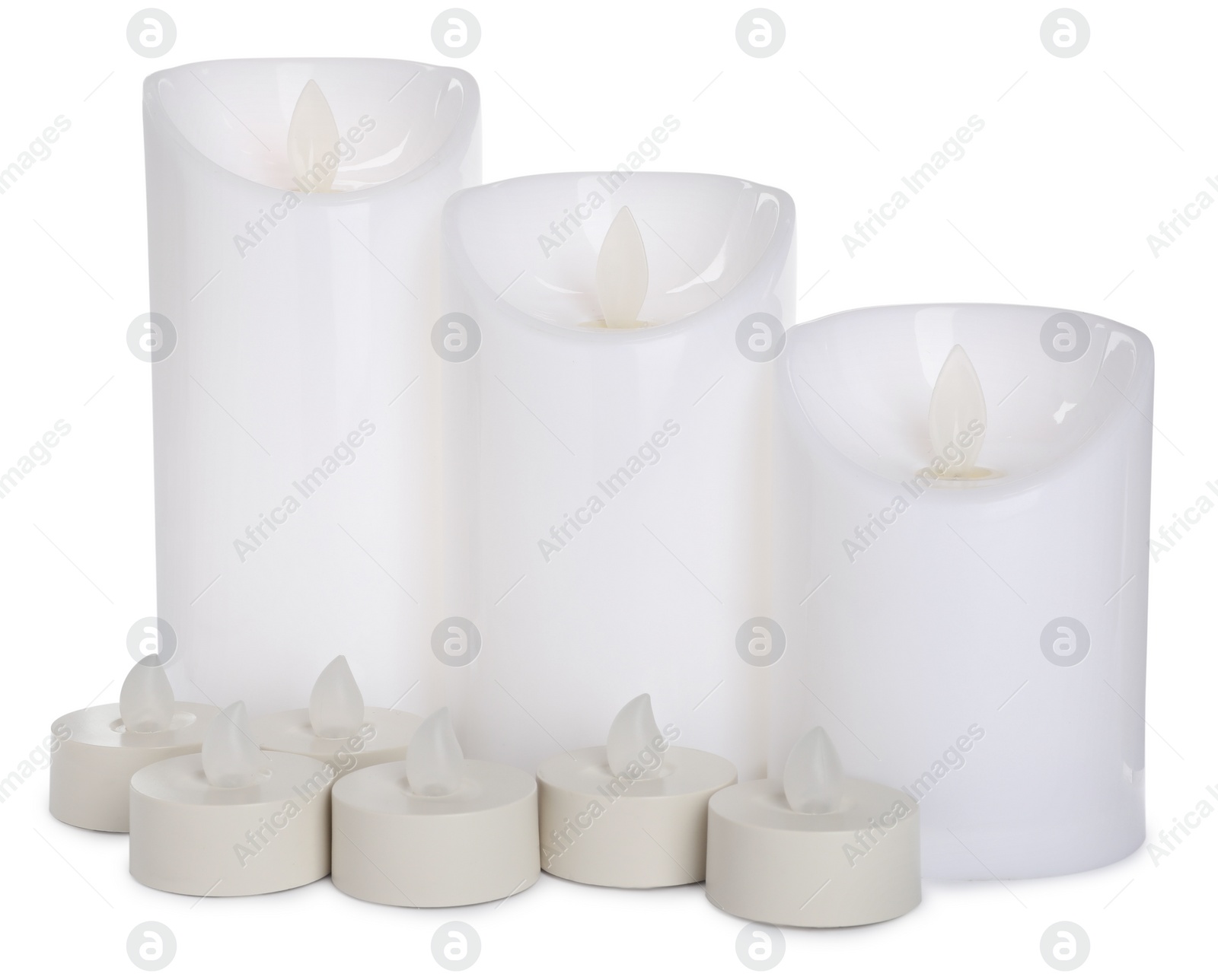 Different decorative flameless LED candles on white background Photo of Different decorative flameless LED candles on white background