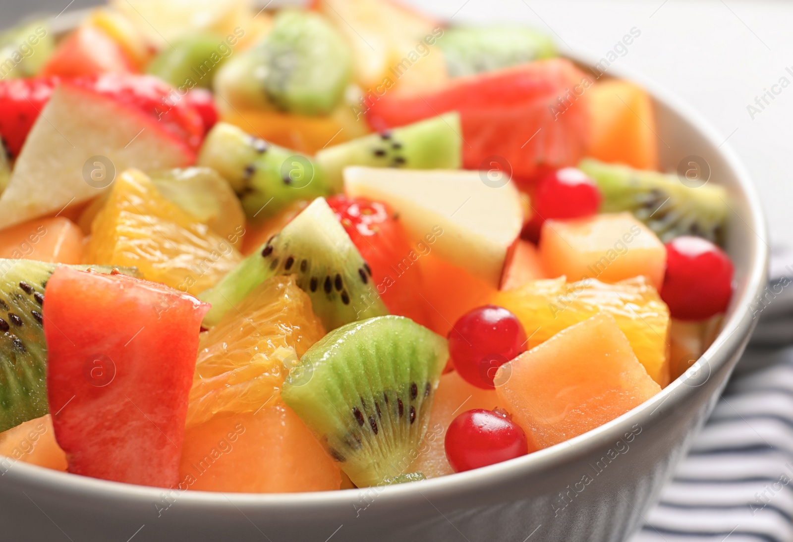 Bowl with fresh cut fruits, closeup Photo of Bowl with fresh cut fruits, closeup