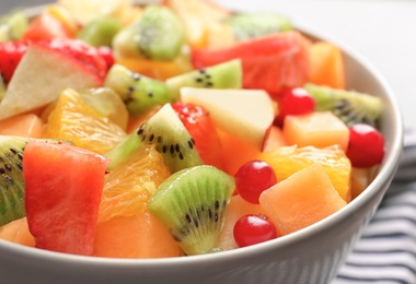 Bowl with fresh cut fruits, closeup Photo of Bowl with fresh cut fruits, closeup