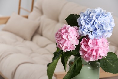Beautiful hortensia flowers in can indoors. Space for text Photo of Beautiful hortensia flowers in can indoors. Space for text