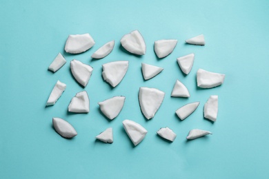 Coconut pieces on color background Photo of Coconut pieces on color background