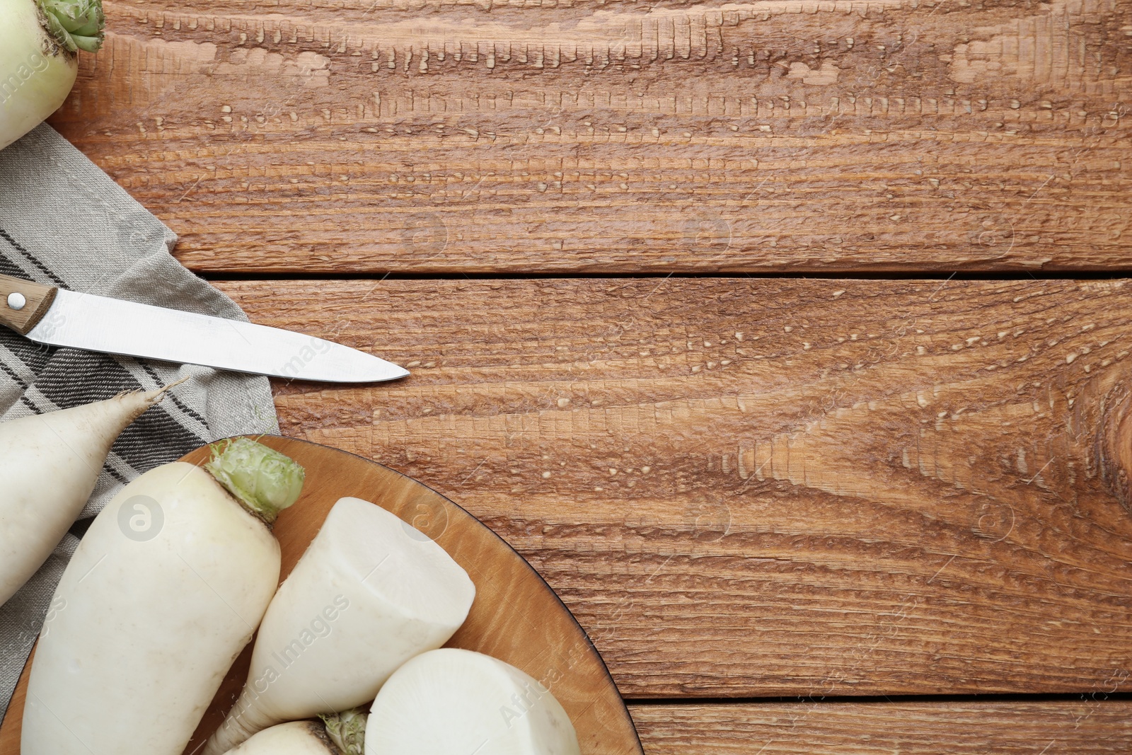 White turnips on wooden table, flat lay. Space for text Photo of White turnips on wooden table, flat lay. Space for text