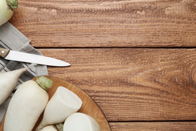 White turnips on wooden table, flat lay. Space for text Photo of White turnips on wooden table, flat lay. Space for text