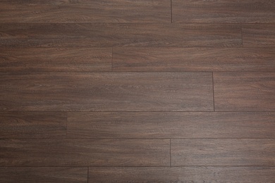 Clean wooden laminate as background, top view. Floor covering Photo of Clean wooden laminate as background, top view. Floor covering