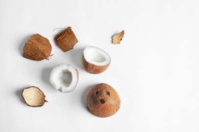Ripe coconuts on white background, top view Photo of Ripe coconuts on white background, top view