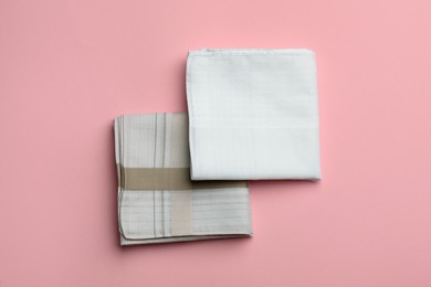 Stylish handkerchiefs on pink background, flat lay Photo of Stylish handkerchiefs on pink background, flat lay