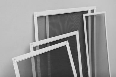 Photo of Set of window screens on light grey background