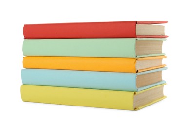 Many colorful hardcover books on white background Photo of Many colorful hardcover books on white background