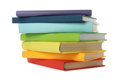 Many colorful hardcover books on white background Photo of Many colorful hardcover books on white background