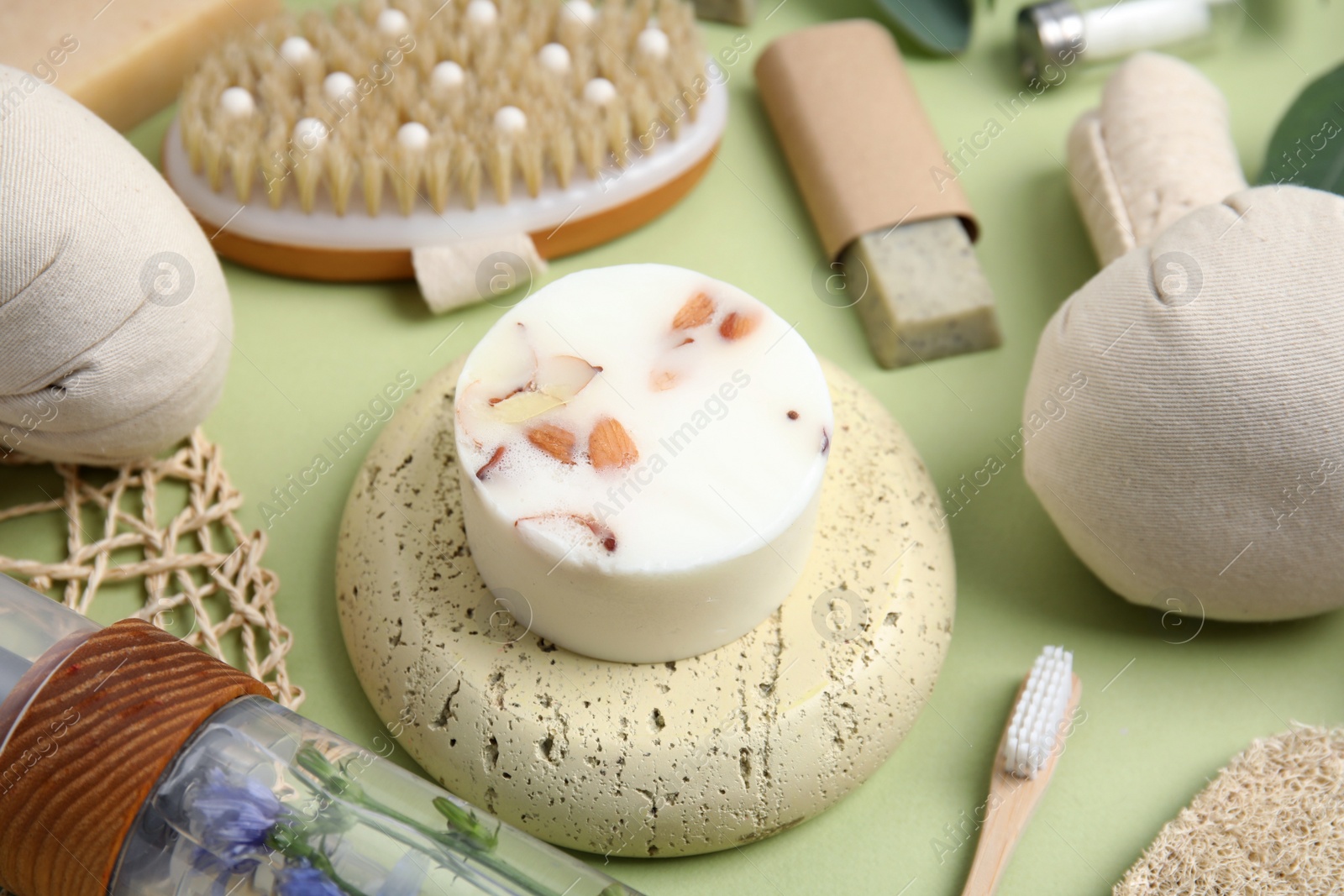 Eco friendly personal care products on light green background, closeup Photo of Eco friendly personal care products on light green background, closeup