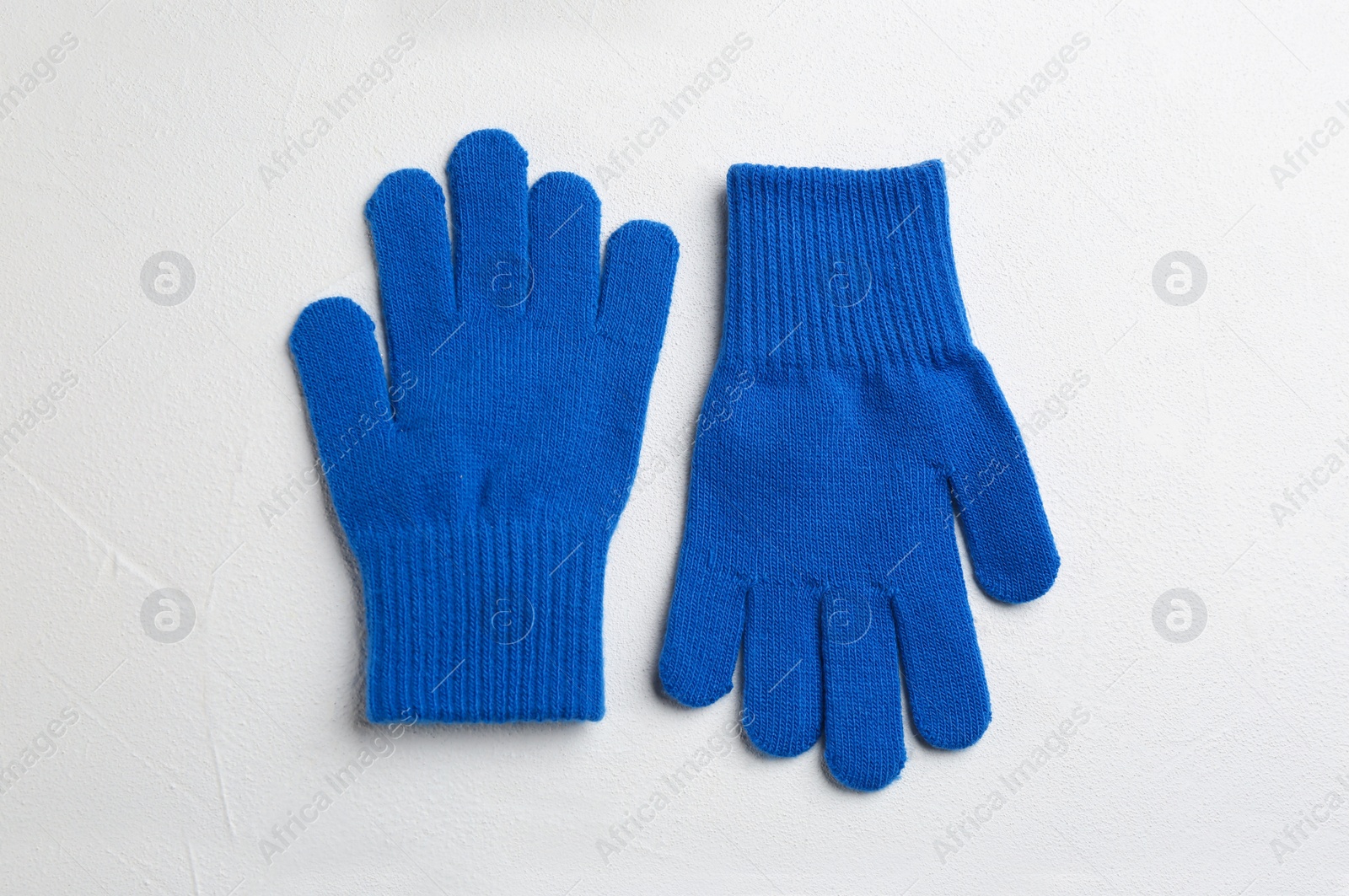 Stylish gloves on white background, flat lay Photo of Stylish gloves on white background, flat lay