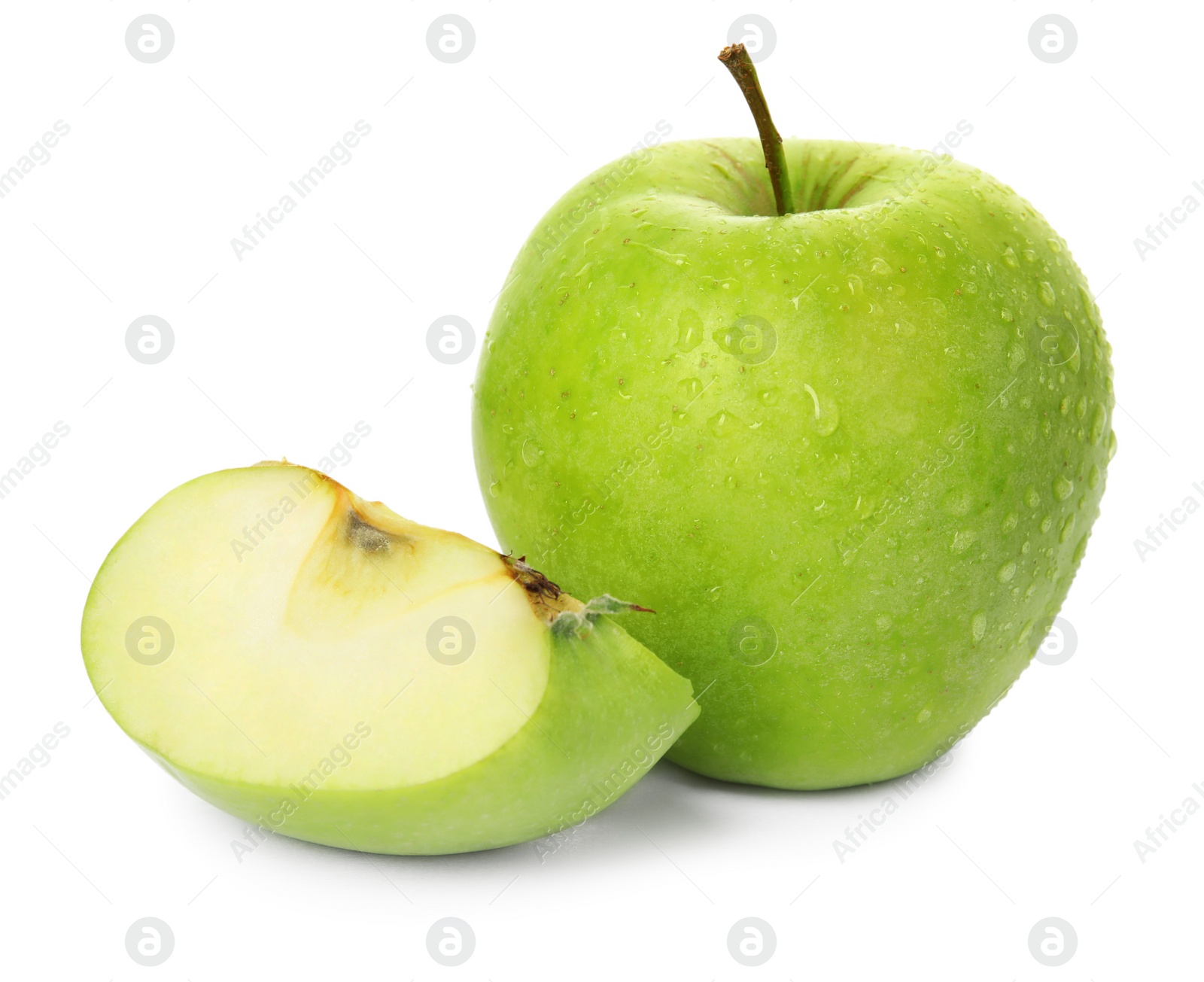 Fresh green cut and whole apples with water drops isolated on white Photo of Fresh green cut and whole apples with water drops isolated on white