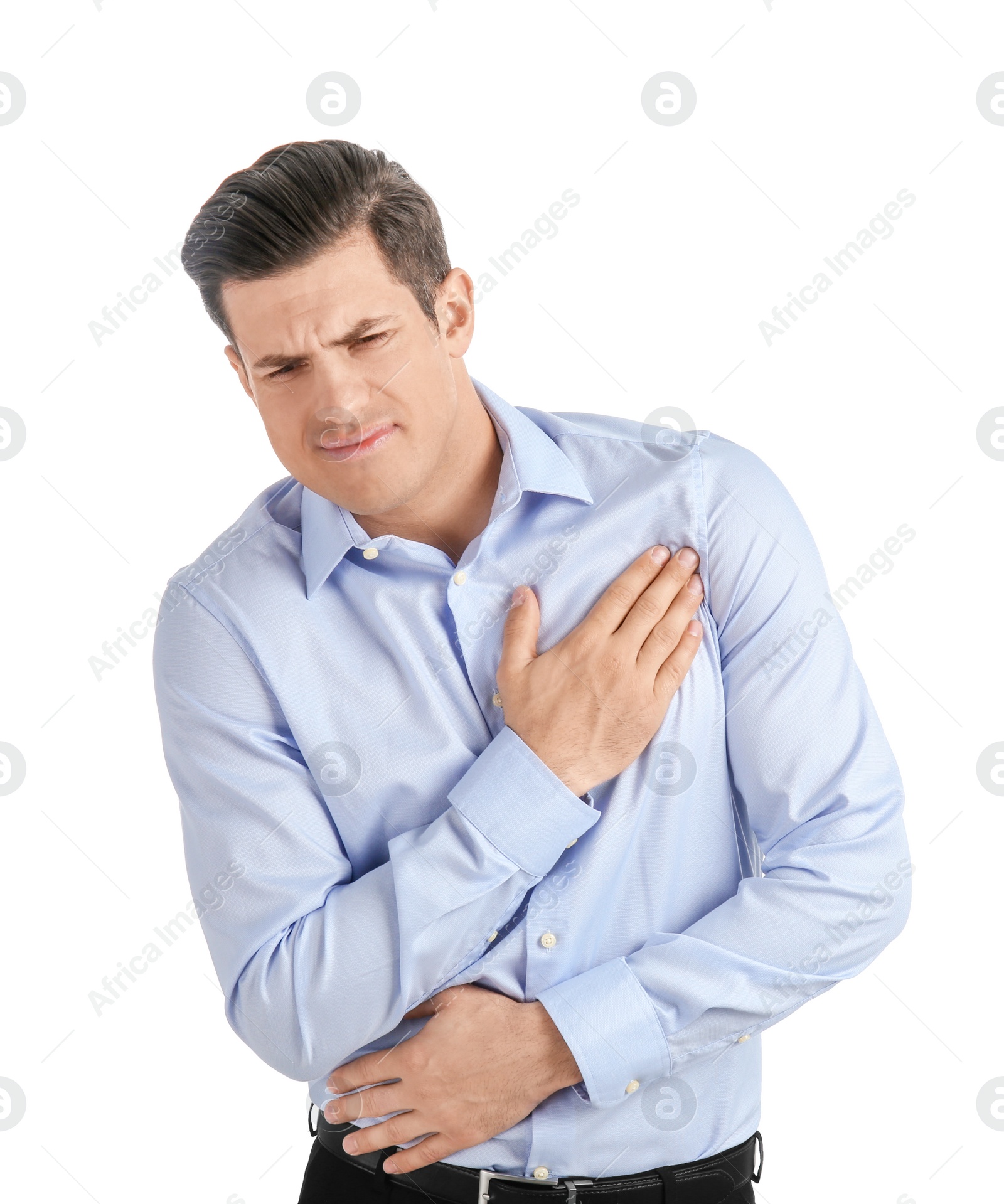 Young man suffering from chest pain on white background Photo of Young man suffering from chest pain on white background