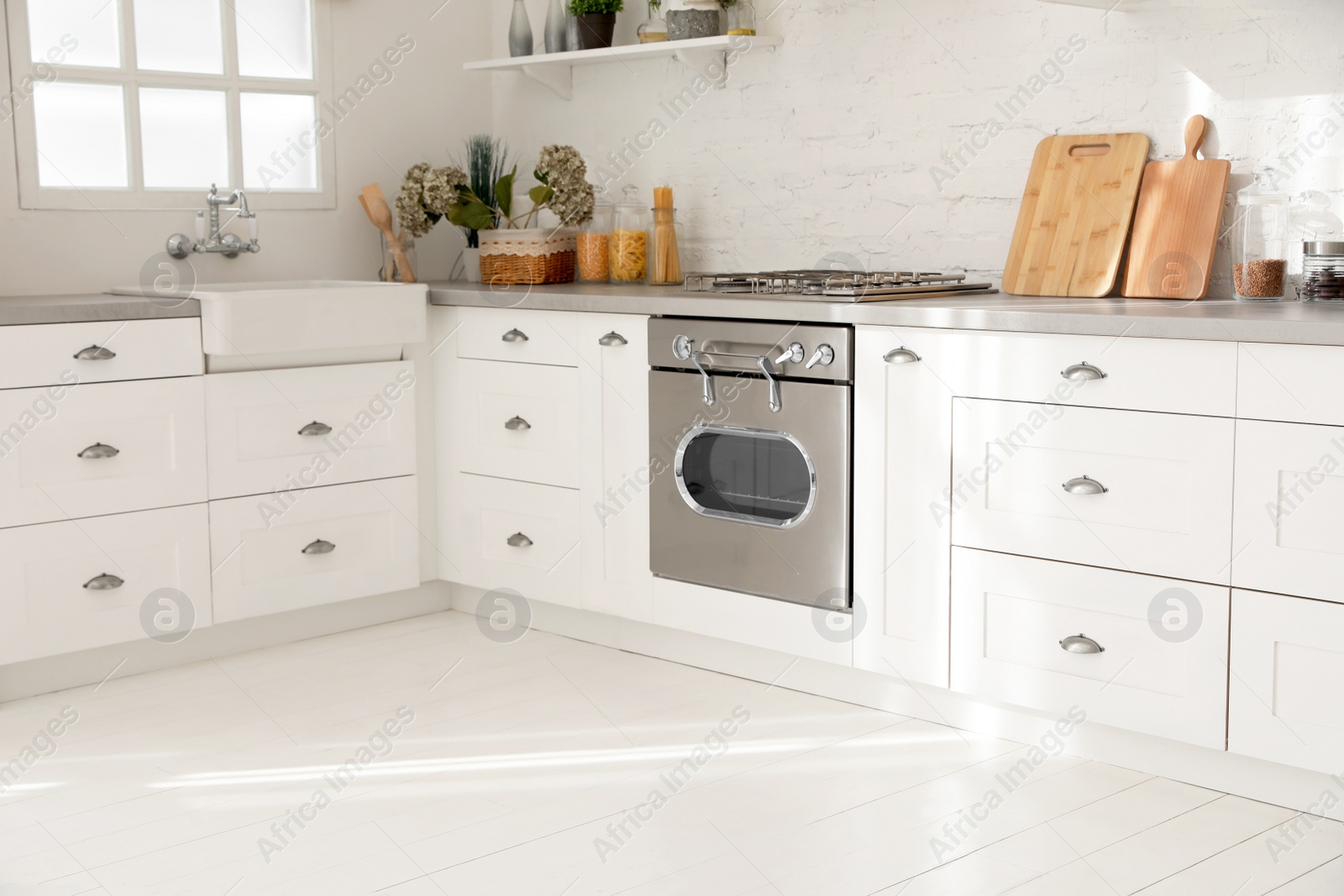 Beautiful kitchen with new modern oven. Cooking appliance Photo of Beautiful kitchen with new modern oven. Cooking appliance