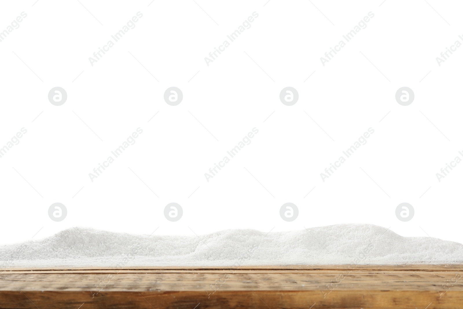 Artificial snow on wooden table against white background. Christmas decor Photo of Artificial snow on wooden table against white background. Christmas decor