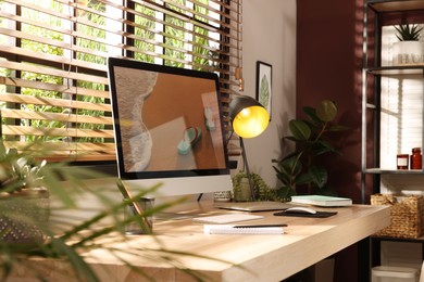Comfortable workplace near window in room. Interior design Photo of Comfortable workplace near window in room. Interior design