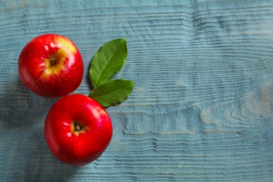 Ripe red apples on wooden background, flat lay Photo of Ripe red apples on wooden background, flat lay