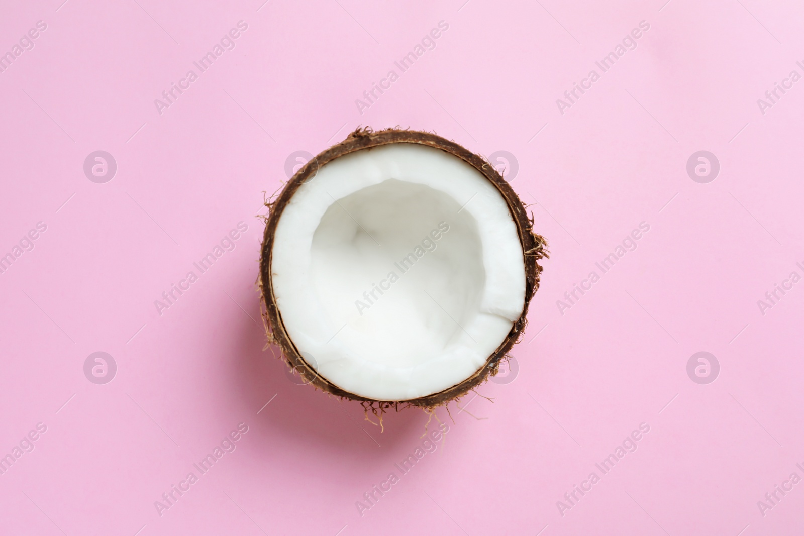 Coconut half on color background Photo of Coconut half on color background