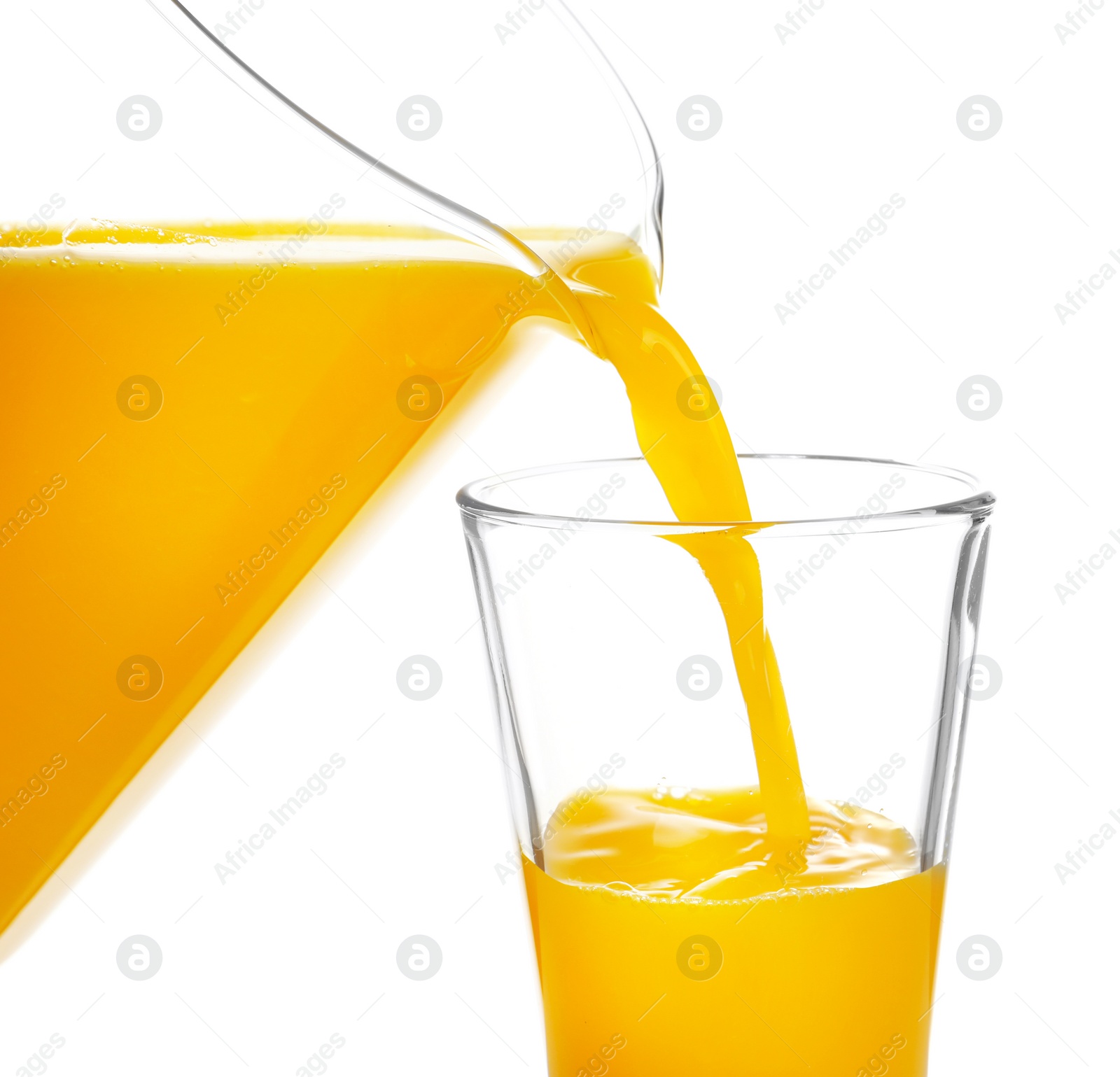 Pouring fresh orange juice into glass on white background Photo of Pouring fresh orange juice into glass on white background