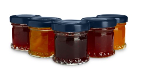 Jars with different jams on white background Photo of Jars with different jams on white background