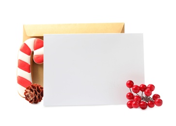 Blank greeting card, envelope and Christmas decor on white background, space for text Photo of Blank greeting card, envelope and Christmas decor on white background, space for text