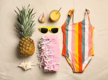 Photo of Flat lay composition with beach objects on sand