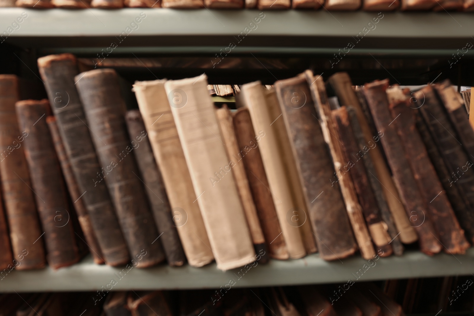 Blurred view of old books on shelf in library Photo of Blurred view of old books on shelf in library