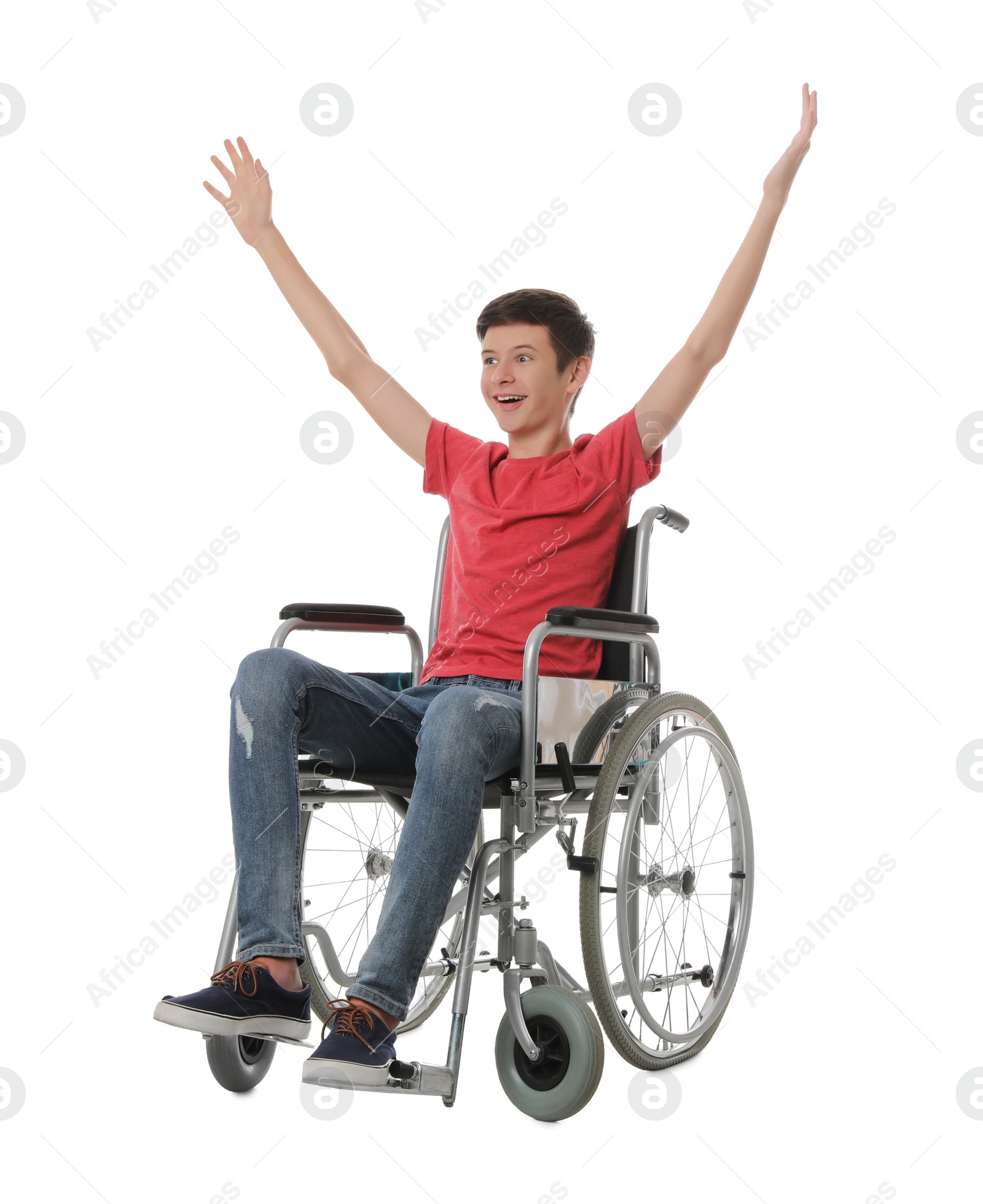 Emotional teen boy in wheelchair on white background Photo of Emotional teen boy in wheelchair on white background