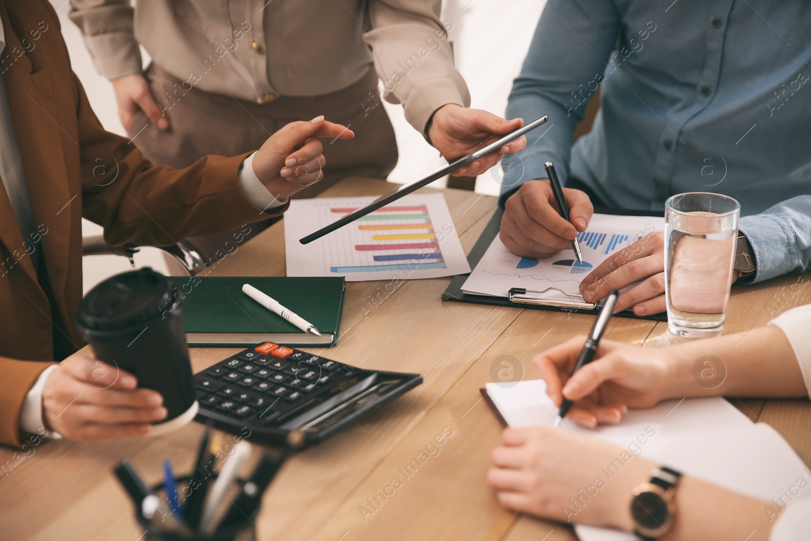 Photo of Businesspeople having meeting in office, closeup. Management consulting