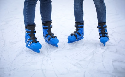 Friends at ice skating rink outdoors, closeup Photo of Friends at ice skating rink outdoors, closeup