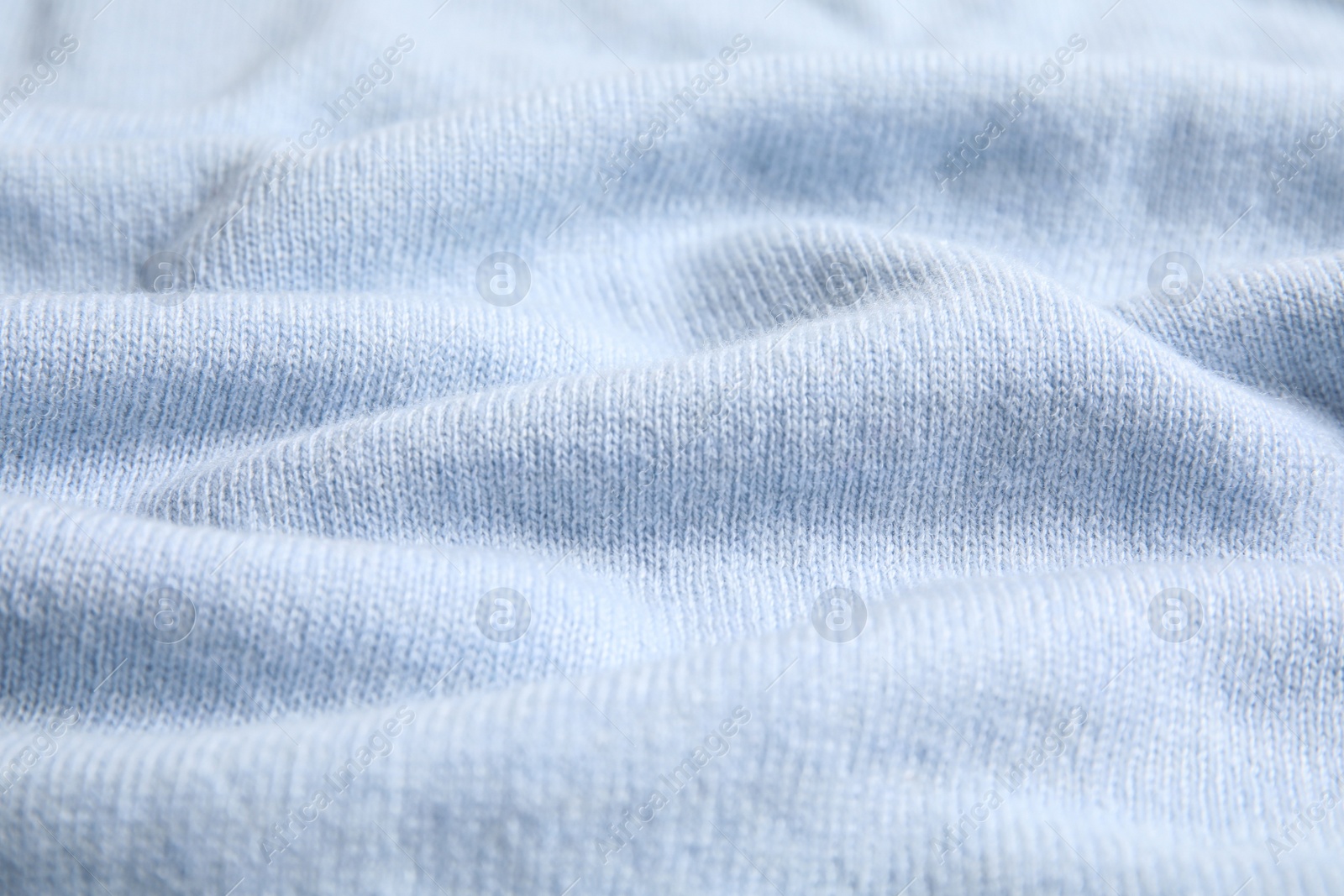 Warm cashmere sweater as background, closeup view Photo of Warm cashmere sweater as background, closeup view