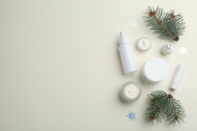 Flat lay composition with different cosmetic products on beige background, space for text. Winter care Photo of Flat lay composition with different cosmetic products on beige background, space for text. Winter care