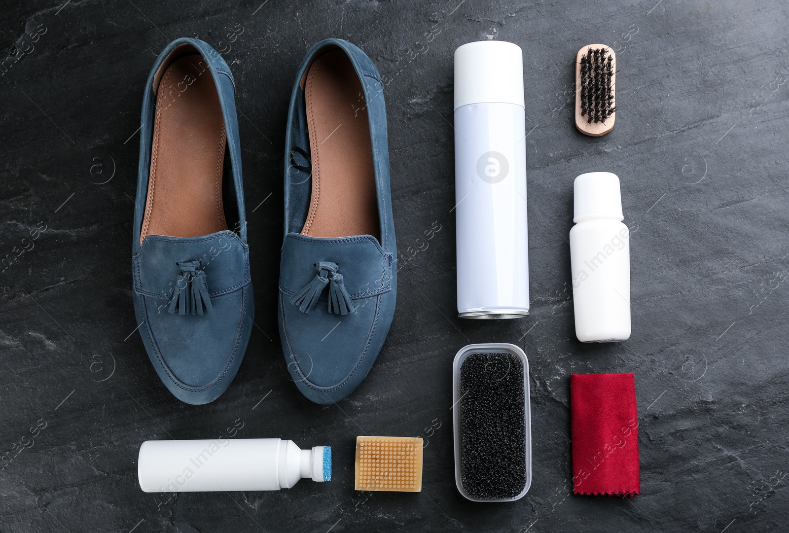 Stylish footwear with shoe care accessories on black table, flat lay Photo of Stylish footwear with shoe care accessories on black table, flat lay