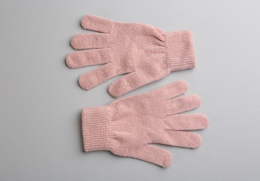 Photo of Pair of stylish woolen gloves on light grey background, flat lay