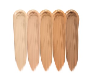 Different shades of liquid skin foundation on white background, top view Image of Different shades of liquid skin foundation on white background, top view