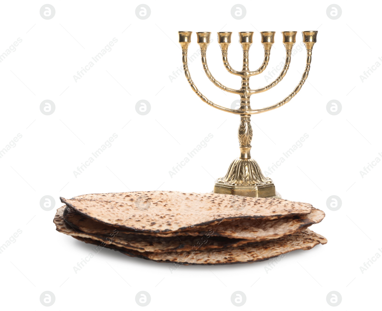 Tasty matzos and menorah on white background. Passover (Pesach) celebration Photo of Tasty matzos and menorah on white background. Passover (Pesach) celebration