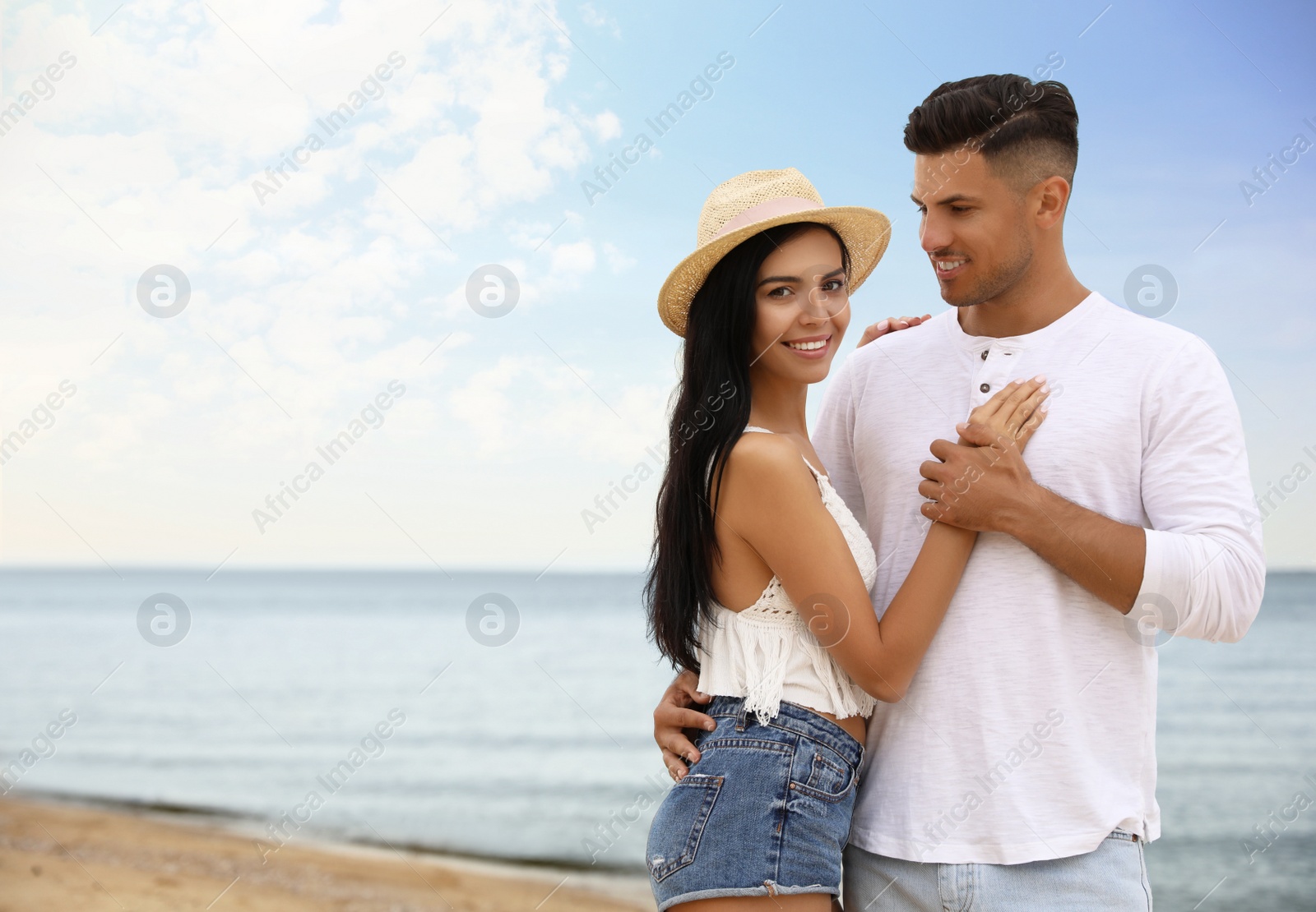 Lovely couple spending time together on beach. Space for text Photo of Lovely couple spending time together on beach. Space for text