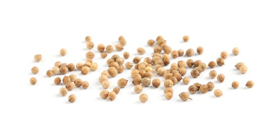 Photo of Scattered dried coriander seeds on white background