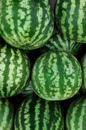 Delicious ripe watermelons as background, top view Photo of Delicious ripe watermelons as background, top view