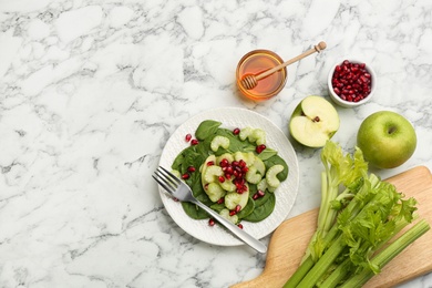 Delicious fresh celery salad served on white marble table, flat lay. Space for text Photo of Delicious fresh celery salad served on white marble table, flat lay. Space for text