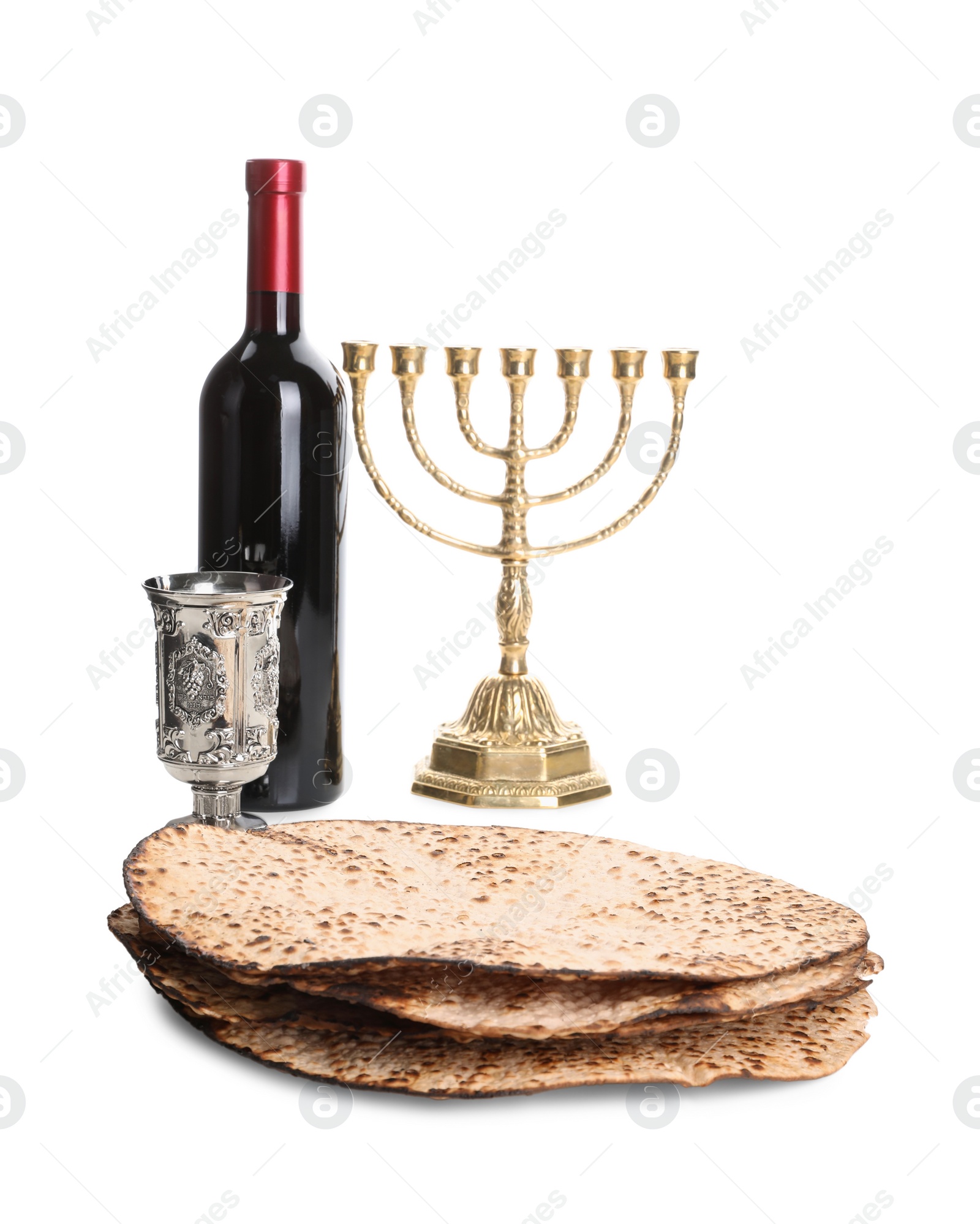 Tasty matzos, wine and menorah on white background. Passover (Pesach) celebration Photo of Tasty matzos, wine and menorah on white background. Passover (Pesach) celebration