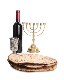 Tasty matzos, wine and menorah on white background. Passover (Pesach) celebration Photo of Tasty matzos, wine and menorah on white background. Passover (Pesach) celebration