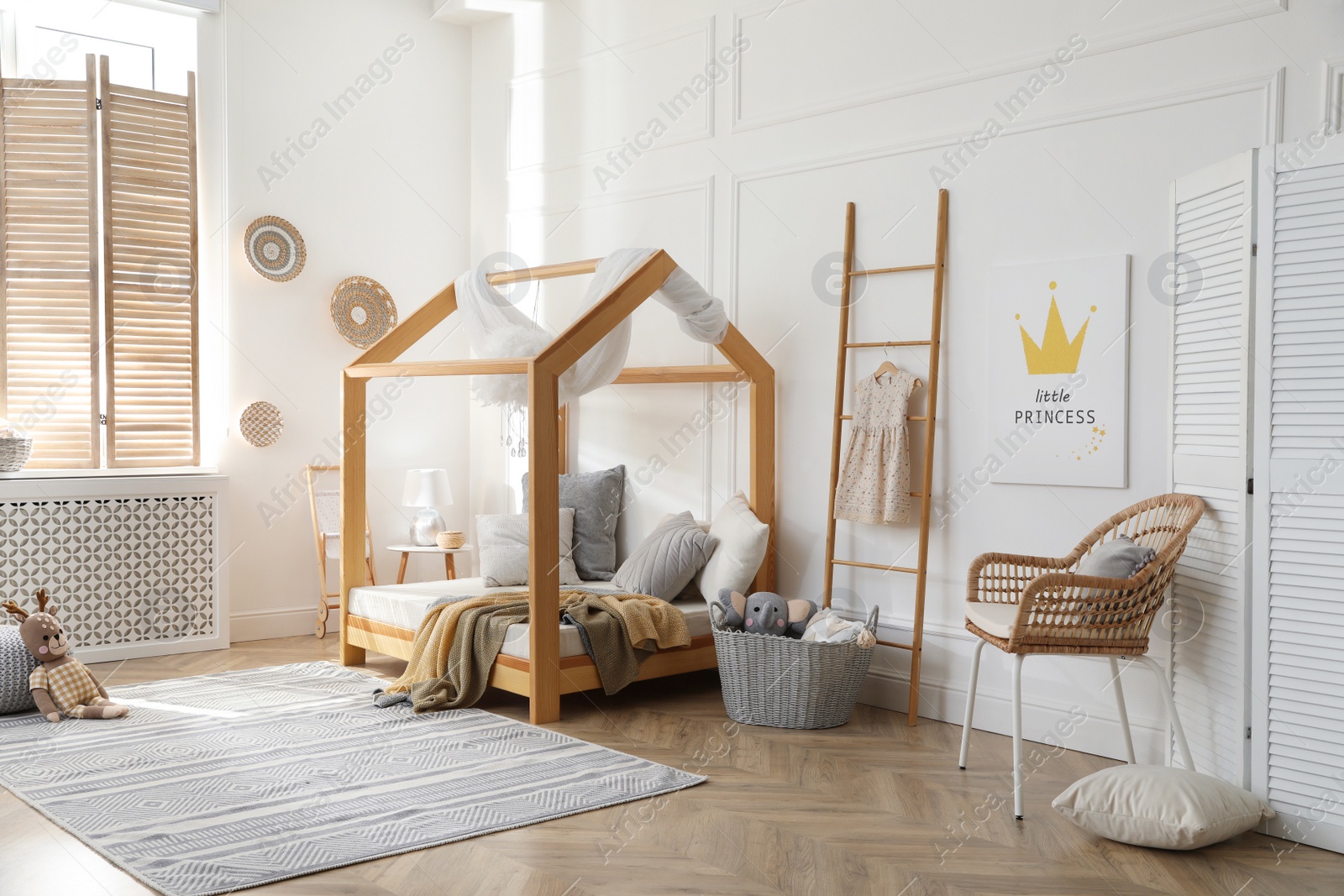 Stylish child room interior with house bed Photo of Stylish child room interior with house bed