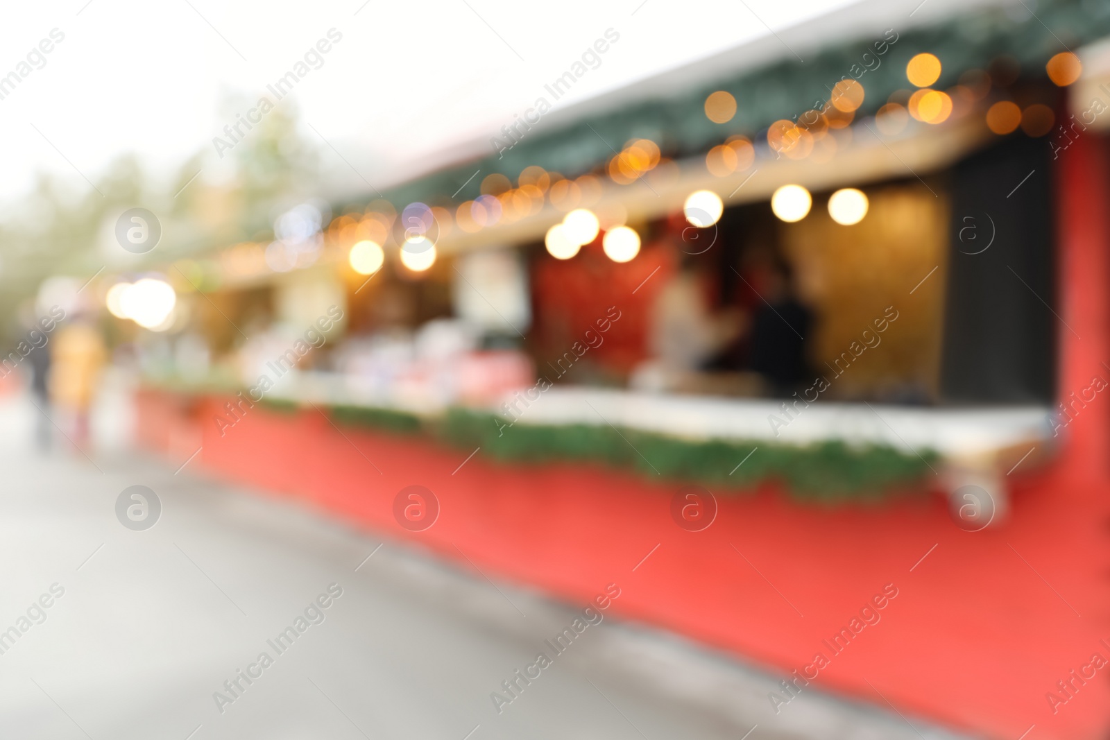 Blurred view of Christmas fair stalls outdoors Photo of Blurred view of Christmas fair stalls outdoors