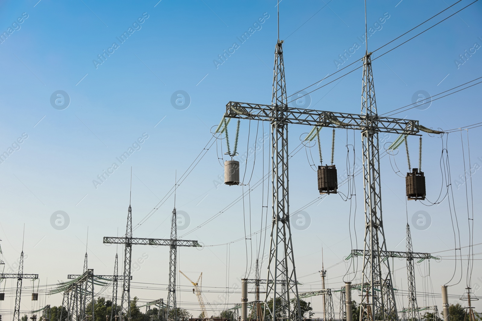 Modern electrical substation outdoors on sunny day Photo of Modern electrical substation outdoors on sunny day